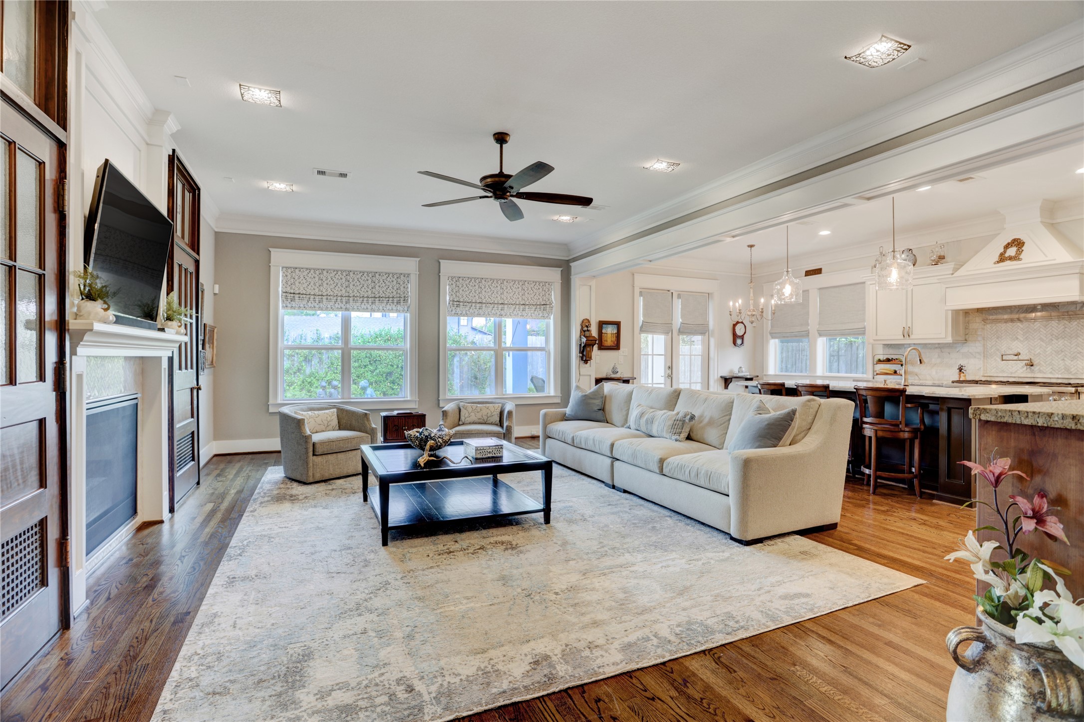 6430 Rolla Street Houston, TX 77055 - Photo 10 of 30 a living room with furniture a flat screen tv and a fireplace