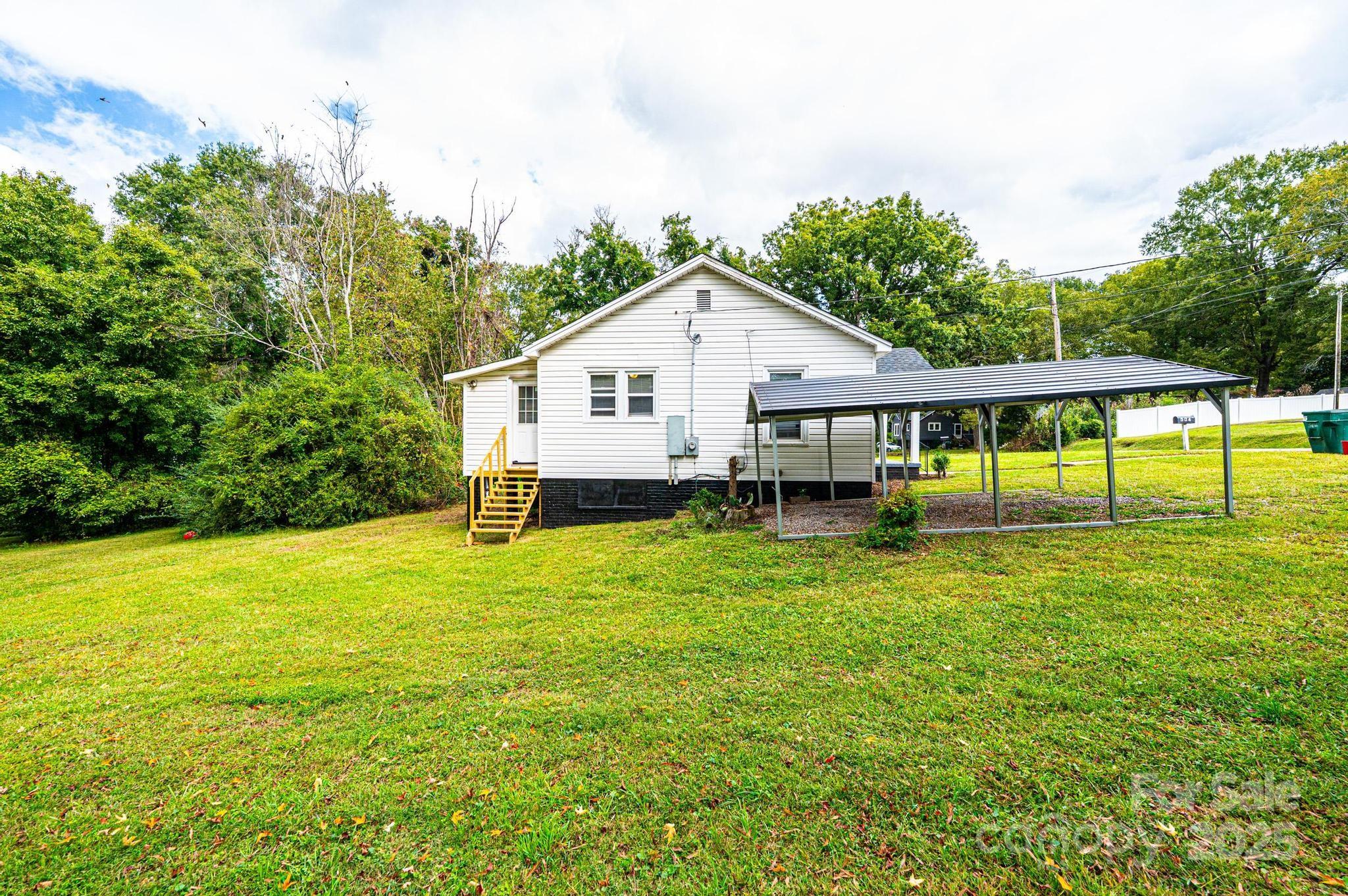 504 North Spring Avenue Newton, NC 28658 - Photo 12 of 35 a view of a house with a backyard