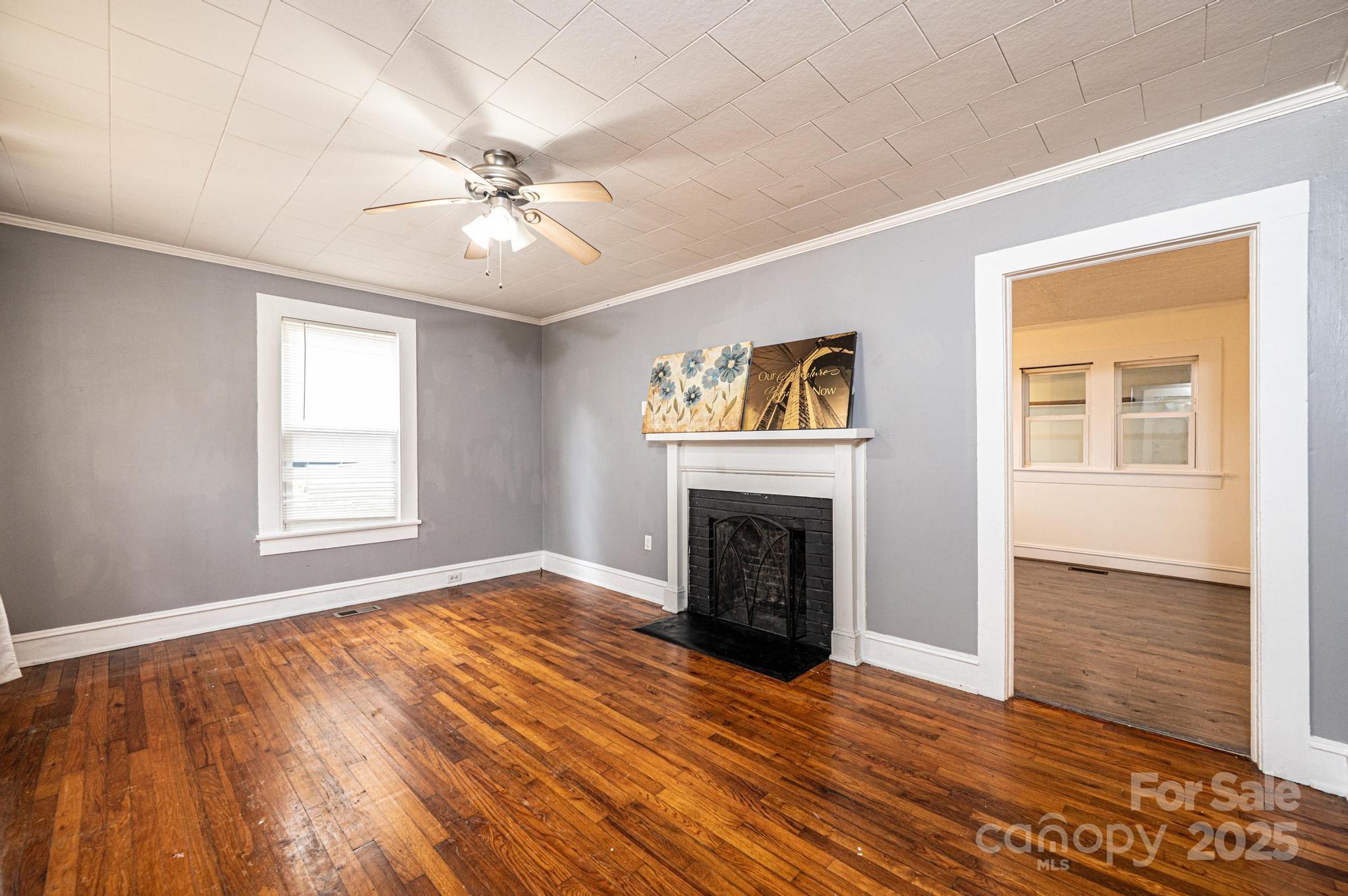 504 North Spring Avenue Newton, NC 28658 - Photo 15 of 35 a view of empty room with wooden floor and fan