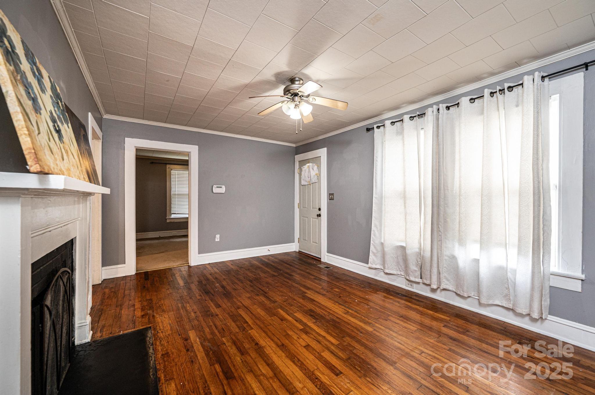 504 North Spring Avenue Newton, NC 28658 - Photo 17 of 35 a view of an empty room with wooden floor and a window