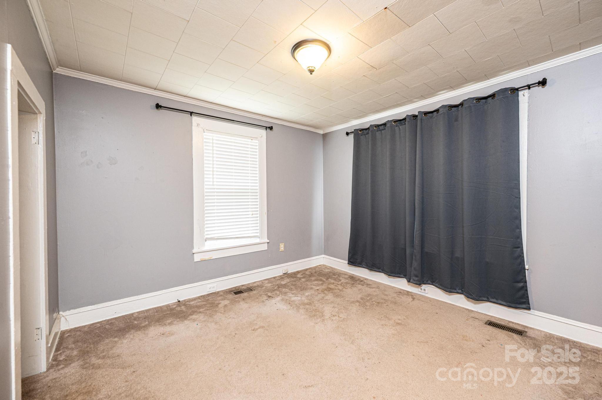 504 North Spring Avenue Newton, NC 28658 - Photo 30 of 35 a view of an empty room with wooden floor
