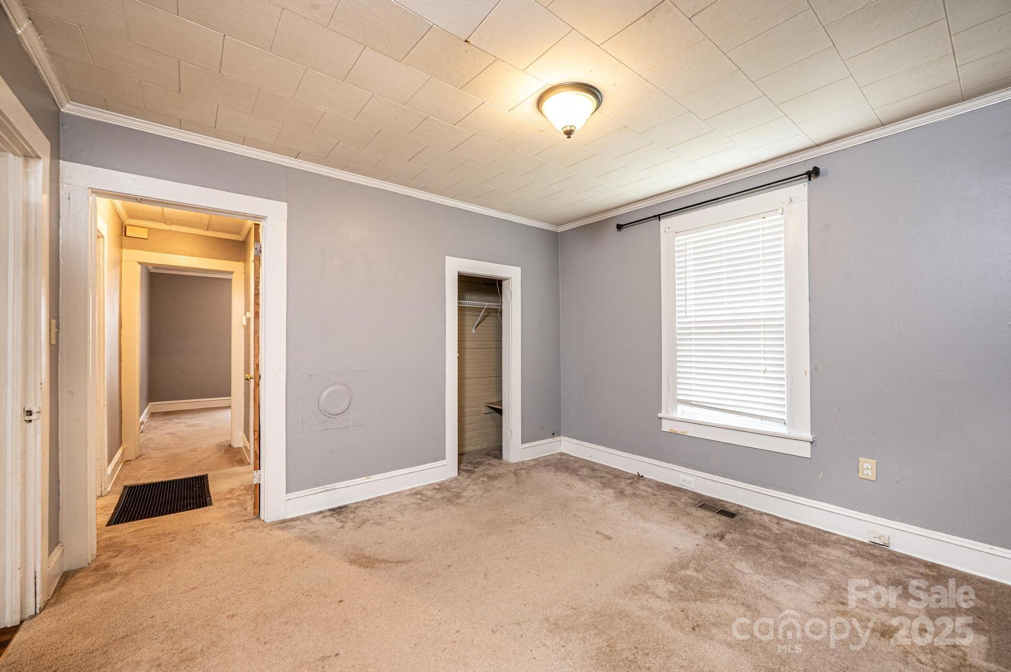 504 North Spring Avenue Newton, NC 28658 - Photo 31 of 35 an empty room with windows and closet
