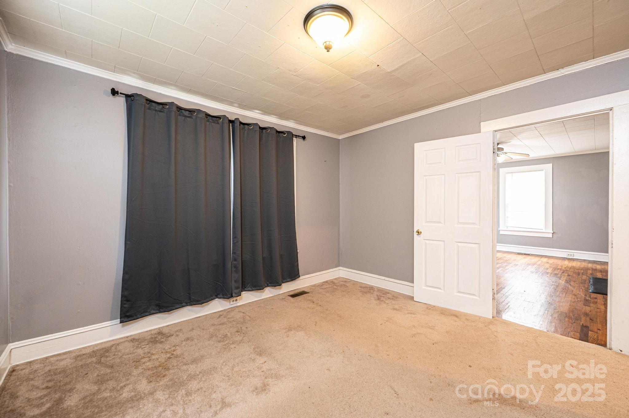 504 North Spring Avenue Newton, NC 28658 - Photo 33 of 35 a view of a livingroom with wooden floor and windows