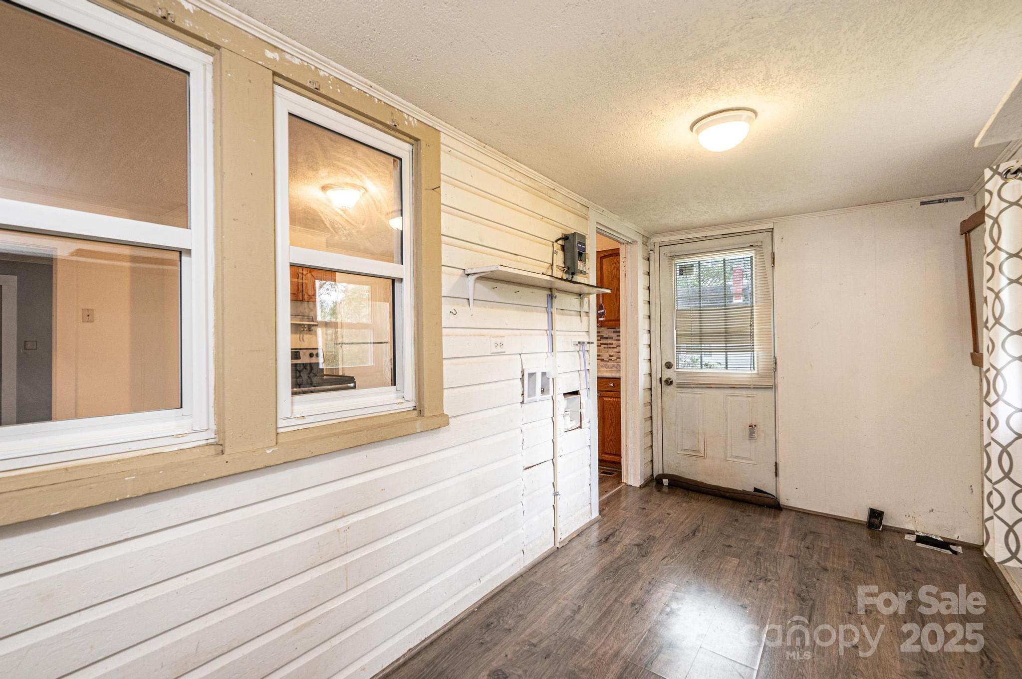 504 North Spring Avenue Newton, NC 28658 - Photo 35 of 35 a view of a kitchen with wooden floor and windows