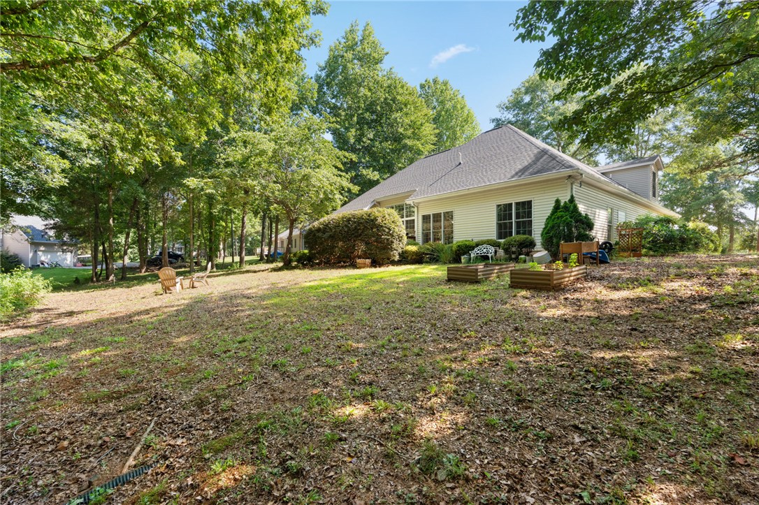 108 Winterbrook Circle Seneca, SC 29678 - Photo 36 of 40 Lush landscaping surrounds this welcoming home, creating a private outdoor retreat.