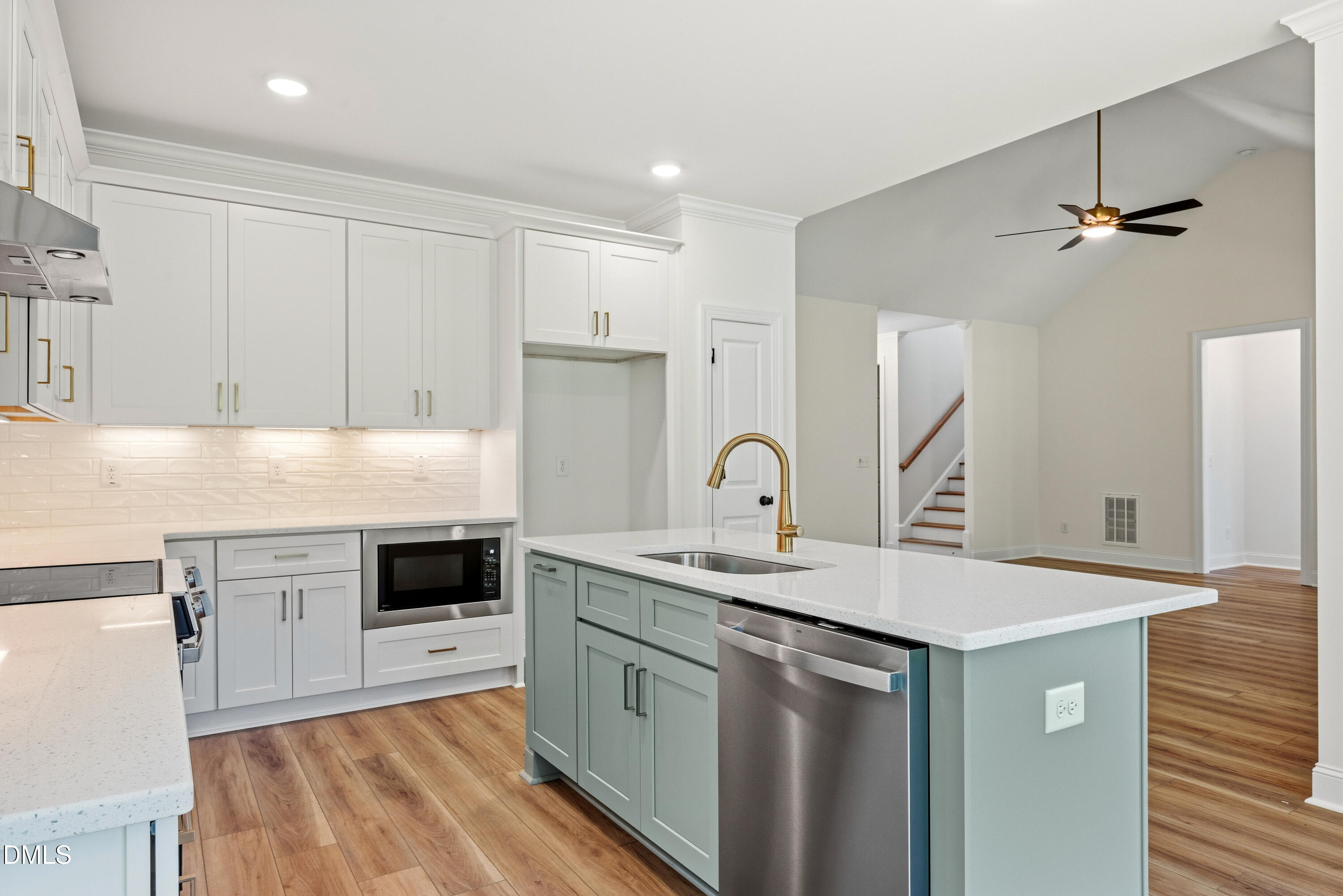 2251 Peachtree Hills Road Spring Hope, NC 27882 - Photo 16 of 46 a kitchen with granite countertop a sink stainless steel appliances and white cabinets