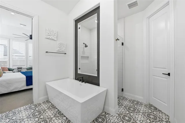 a bathroom with a sink a mirror and a shower