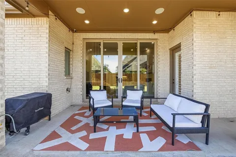 a living room with furniture and a rug