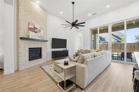 a living room with furniture fireplace and a flat screen tv
