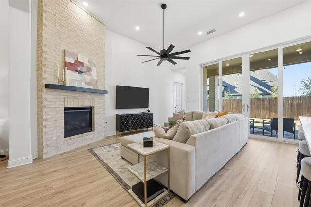 a living room with furniture fireplace and a flat screen tv