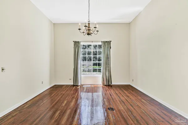 a kitchen with granite countertop a sink and a wooden cabinets