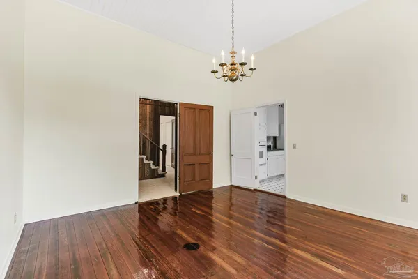 a kitchen with granite countertop a sink and cabinets