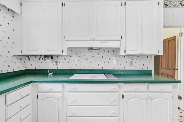 a view of a livingroom with furniture ceiling fan and window