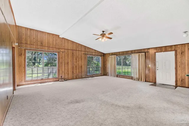 a view of staircase with white walls and windows