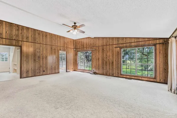 a view of a room with gym equipment and a window