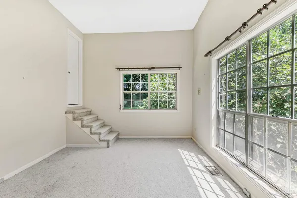 a bathroom with a toilet a sink and a large mirror