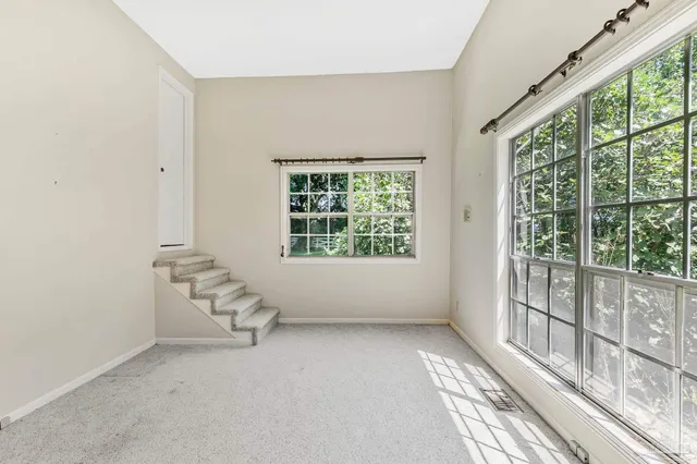 a bathroom with a toilet a sink and a large mirror