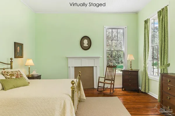 a bedroom with a bed and a fireplace