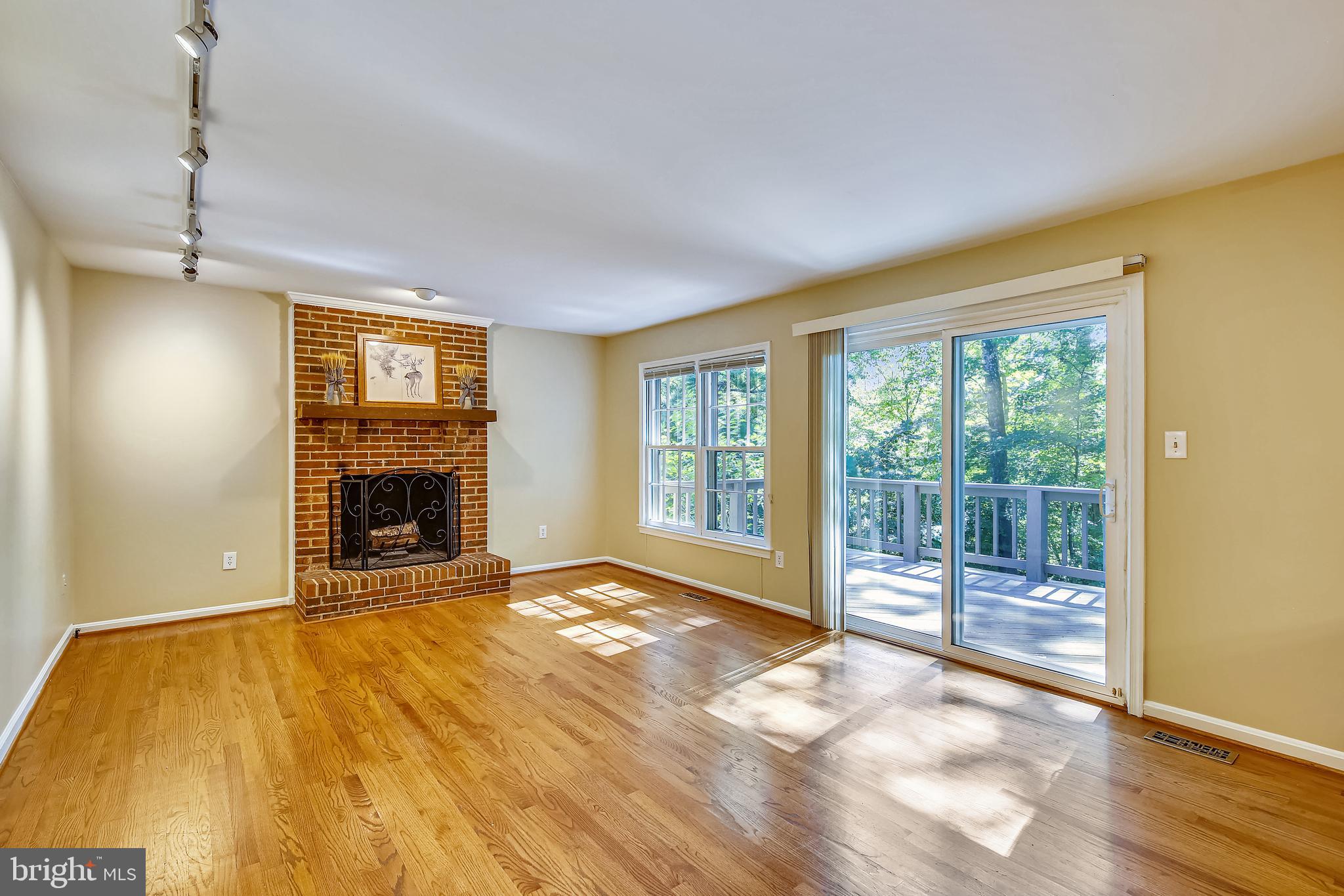 11955 Grey Squirrel Lane Reston, VA 20194 - Photo 18 of 61 open to large deck with steps down to rear yard