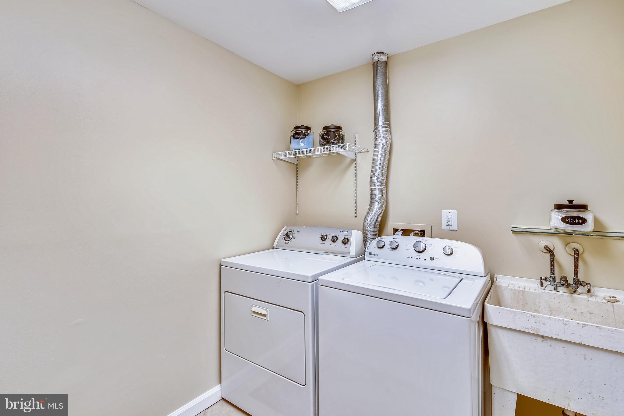 11955 Grey Squirrel Lane Reston, VA 20194 - Photo 34 of 61 Washer, dryer and wash tub in laundry room