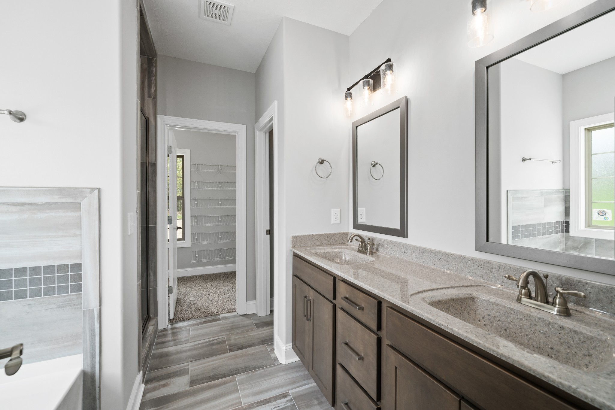 267 Alonzo Place Cunningham, TN 37052 - Photo 19 of 40 a bathroom with a granite countertop sink mirror and double