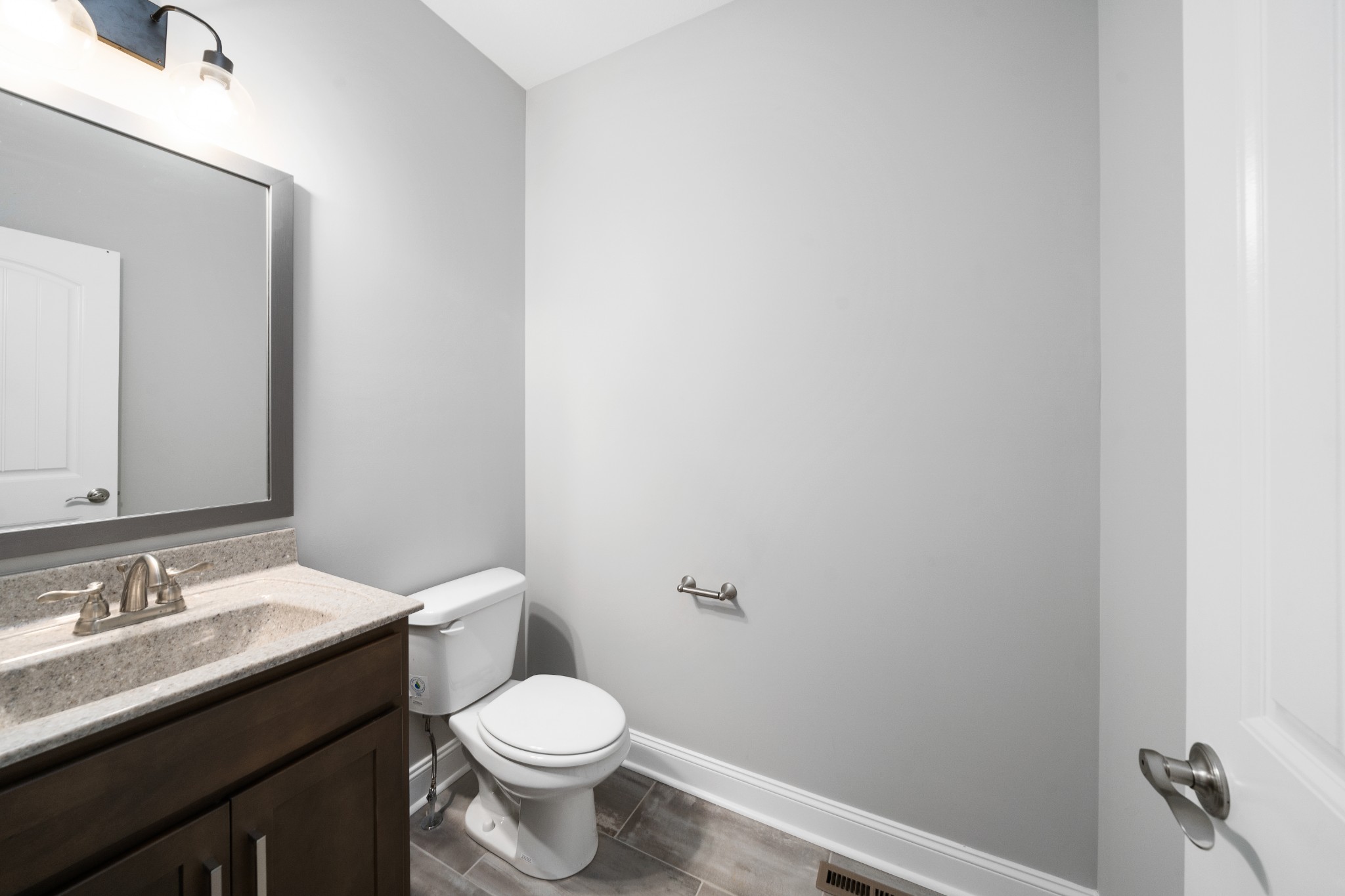 267 Alonzo Place Cunningham, TN 37052 - Photo 24 of 40 a bathroom with a granite countertop toilet and sink
