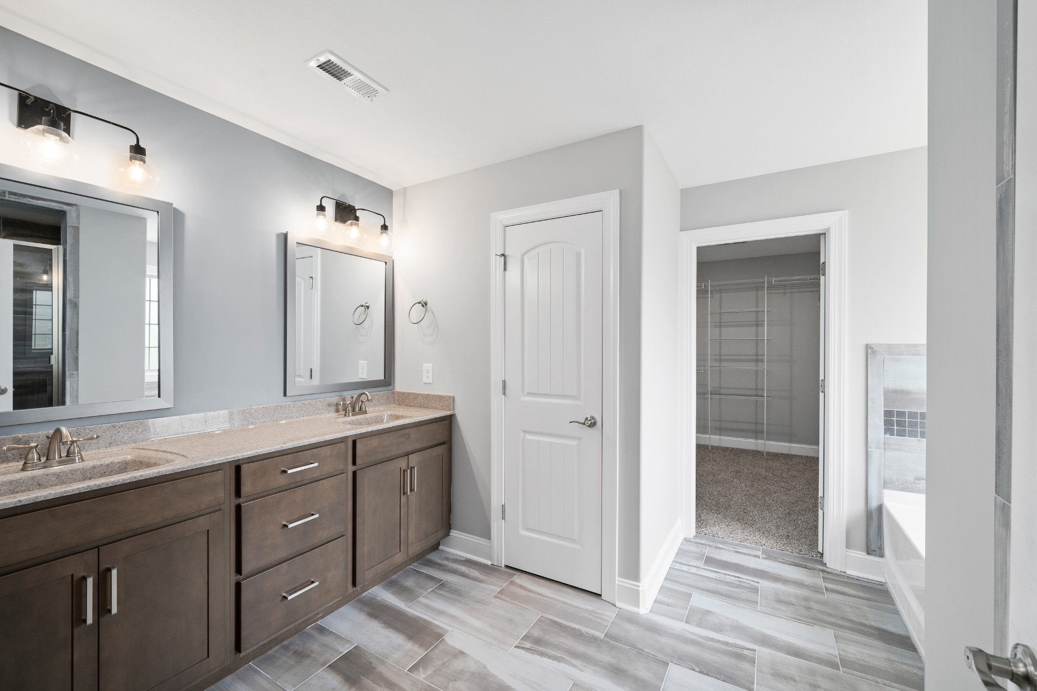 267 Alonzo Place Cunningham, TN 37052 - Photo 28 of 40 a spacious bathroom with a granite countertop sink mirror and double
