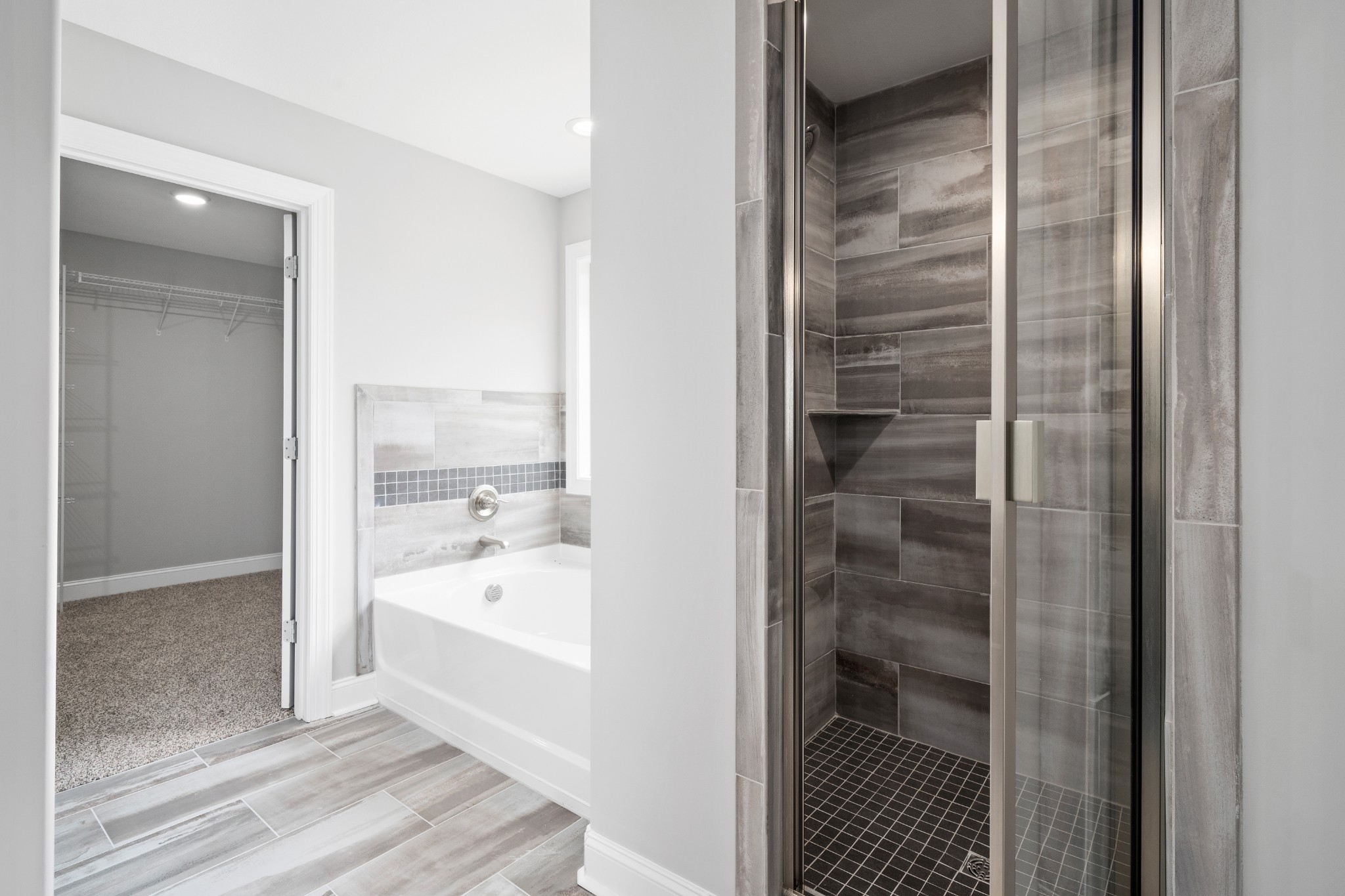 267 Alonzo Place Cunningham, TN 37052 - Photo 29 of 40 a bathroom with a bathtub and a shower