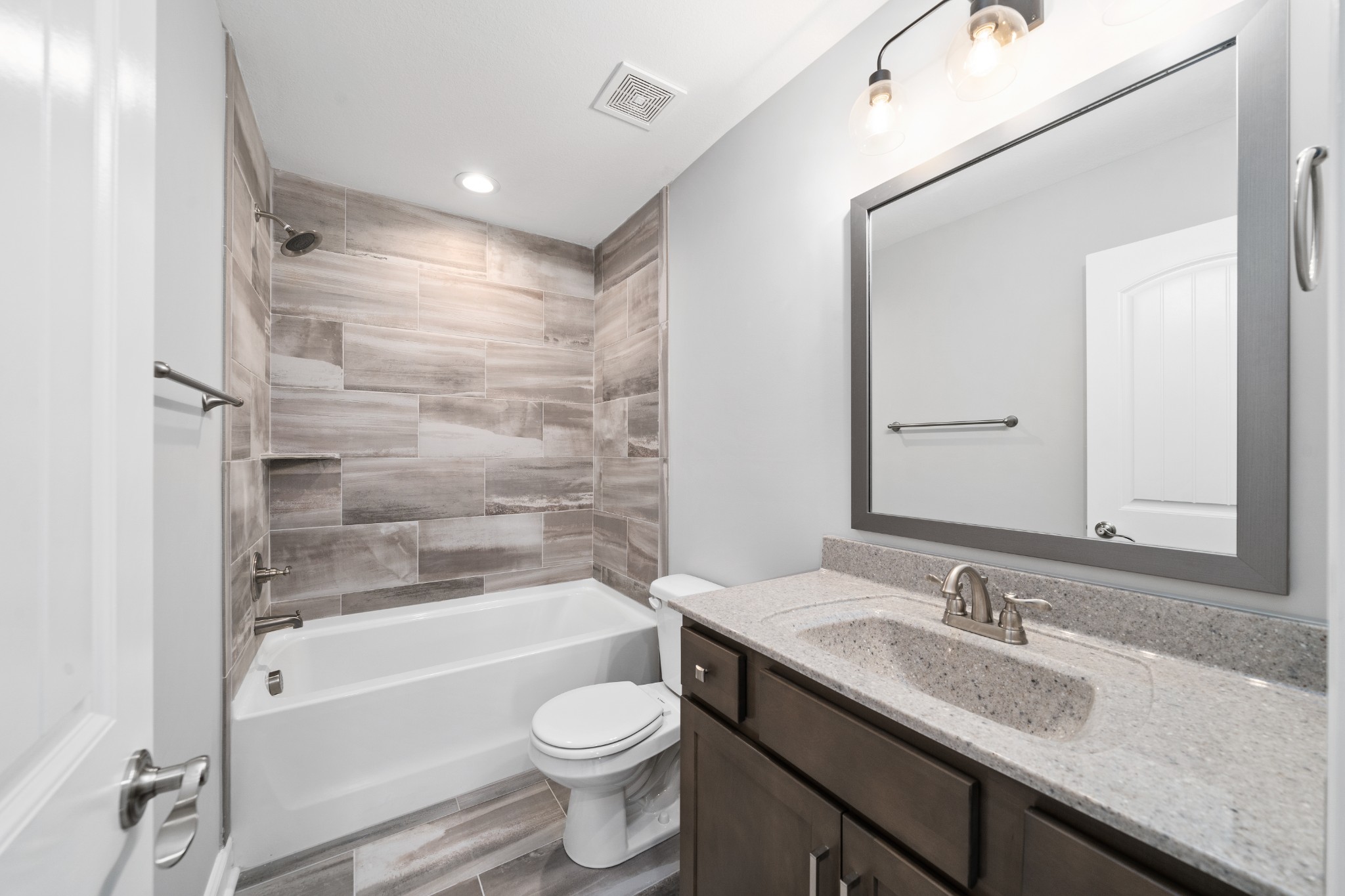 267 Alonzo Place Cunningham, TN 37052 - Photo 33 of 40 a bathroom with a granite countertop sink toilet and shower