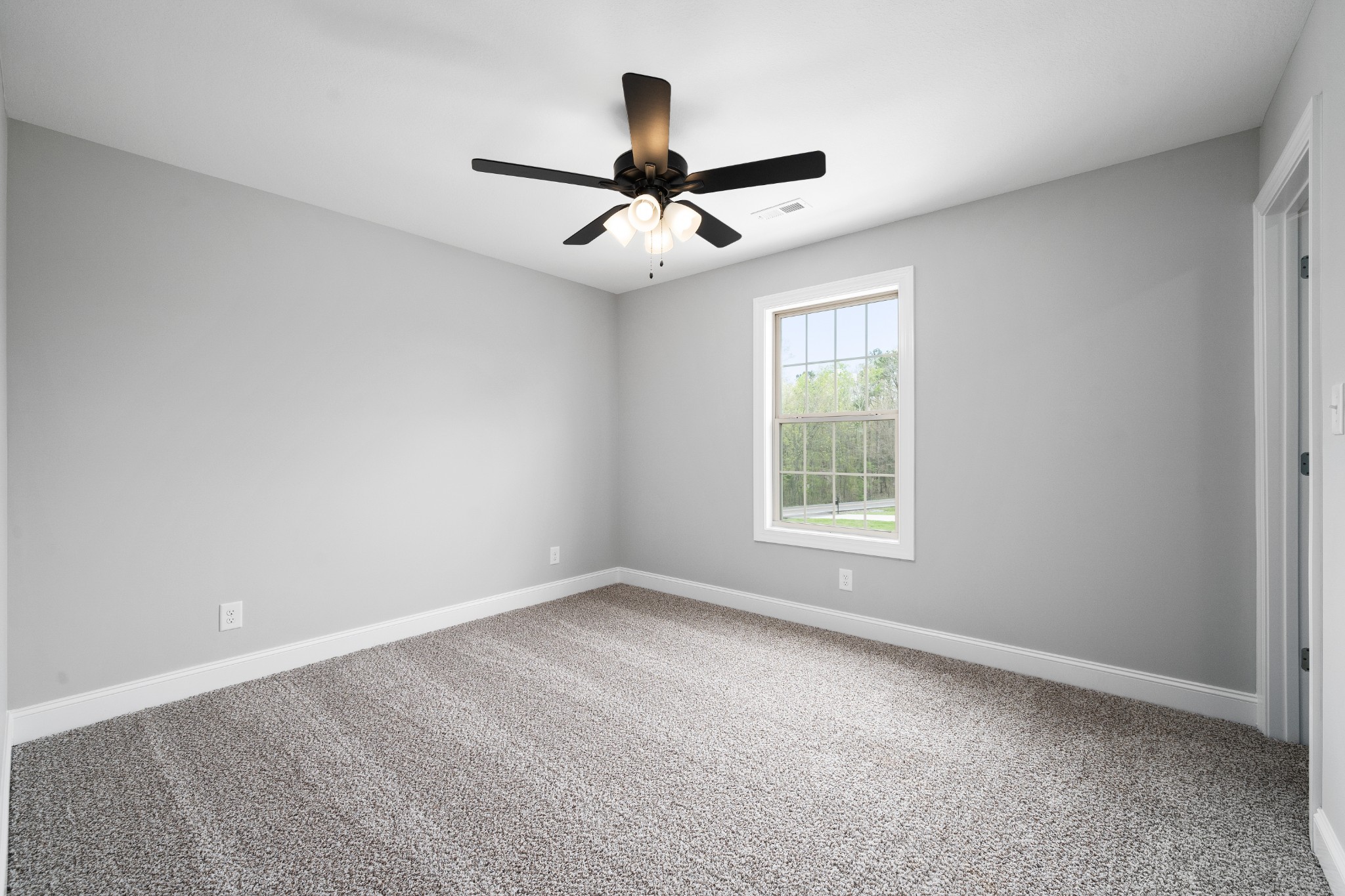 267 Alonzo Place Cunningham, TN 37052 - Photo 35 of 40 an empty room with a window and a fan