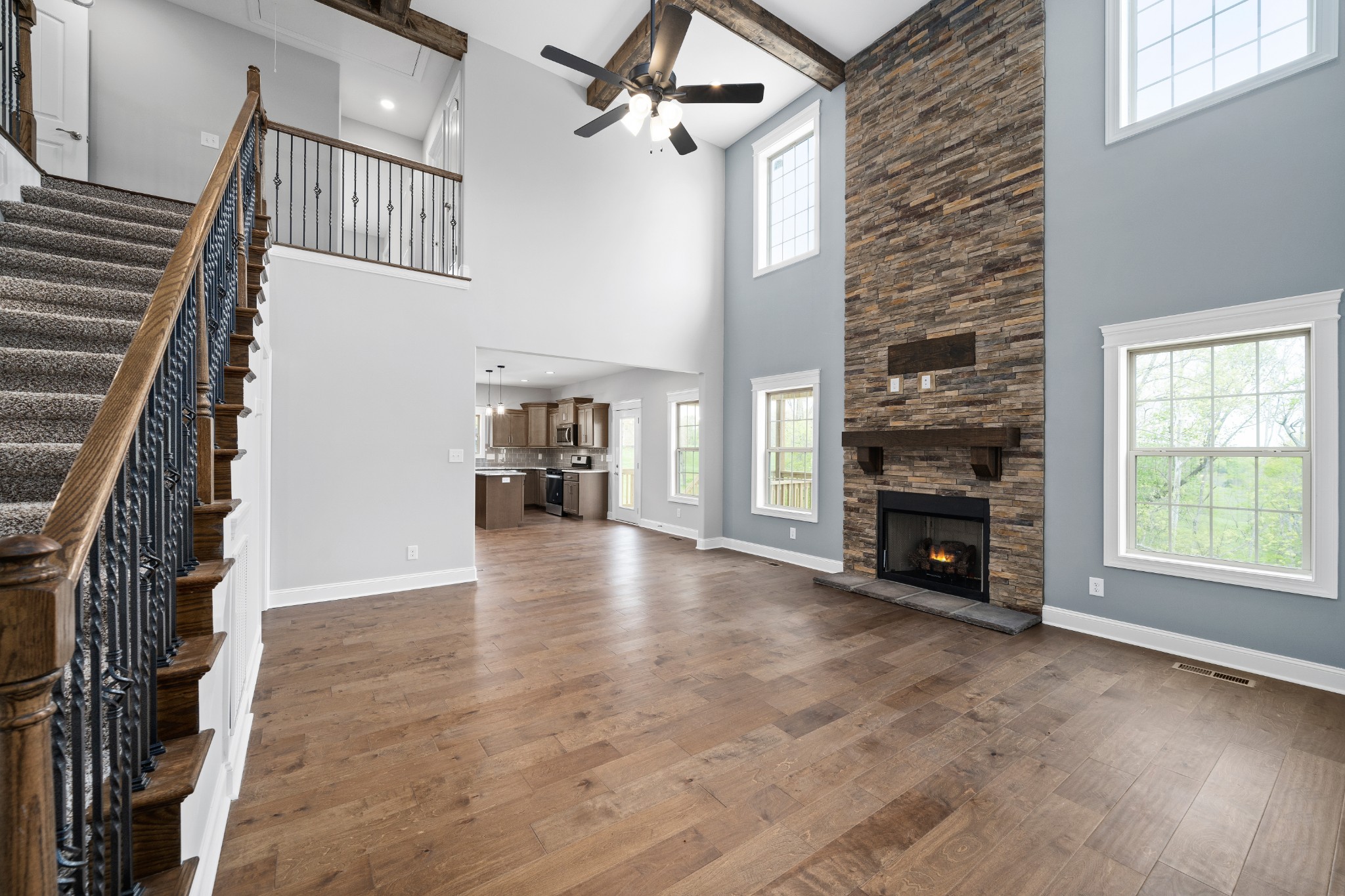 267 Alonzo Place Cunningham, TN 37052 - Photo 6 of 40 a view of empty room with fireplace and wooden floor
