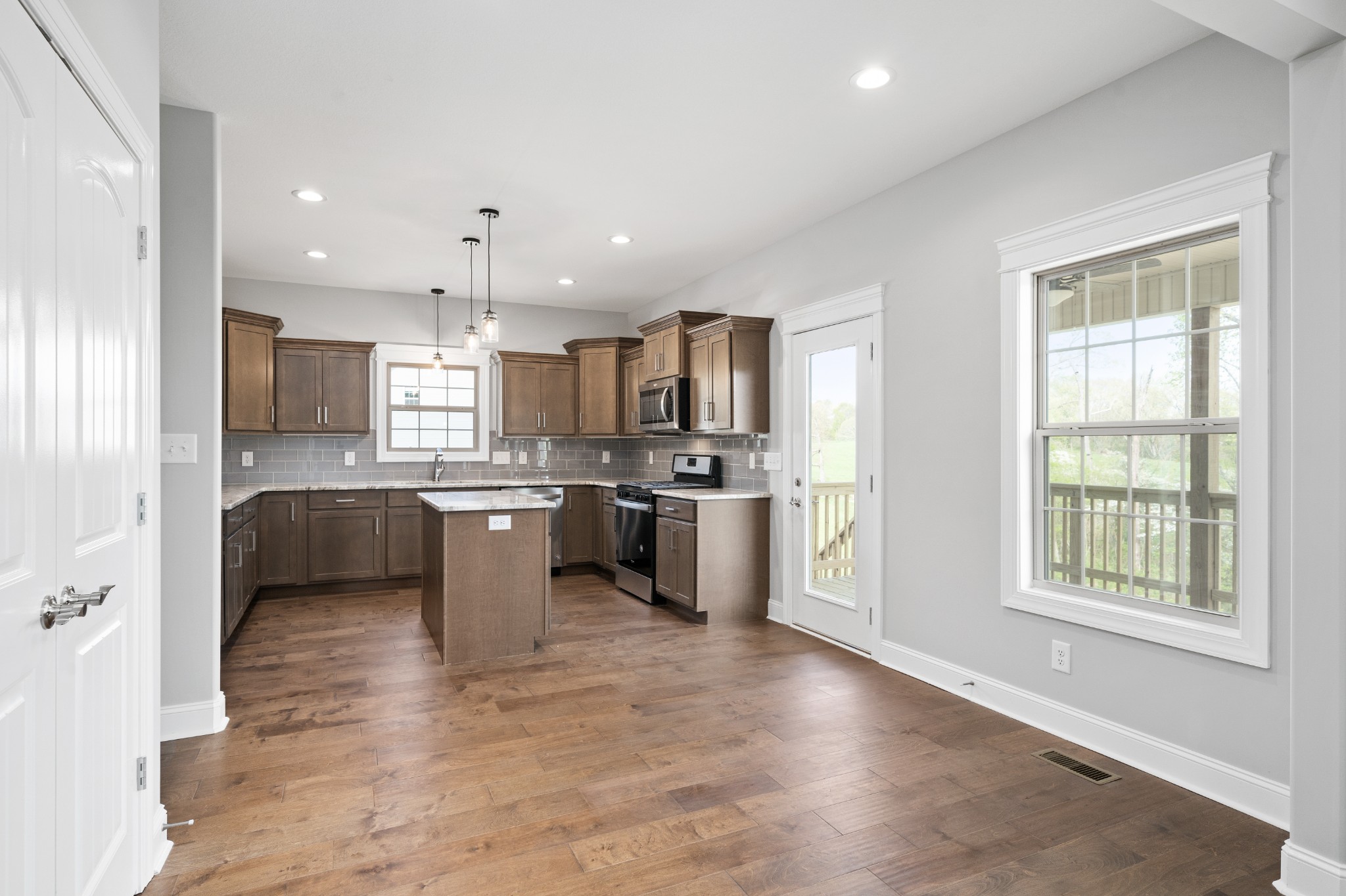 267 Alonzo Place Cunningham, TN 37052 - Photo 8 of 40 a kitchen with a sink stainless steel appliances and cabinets