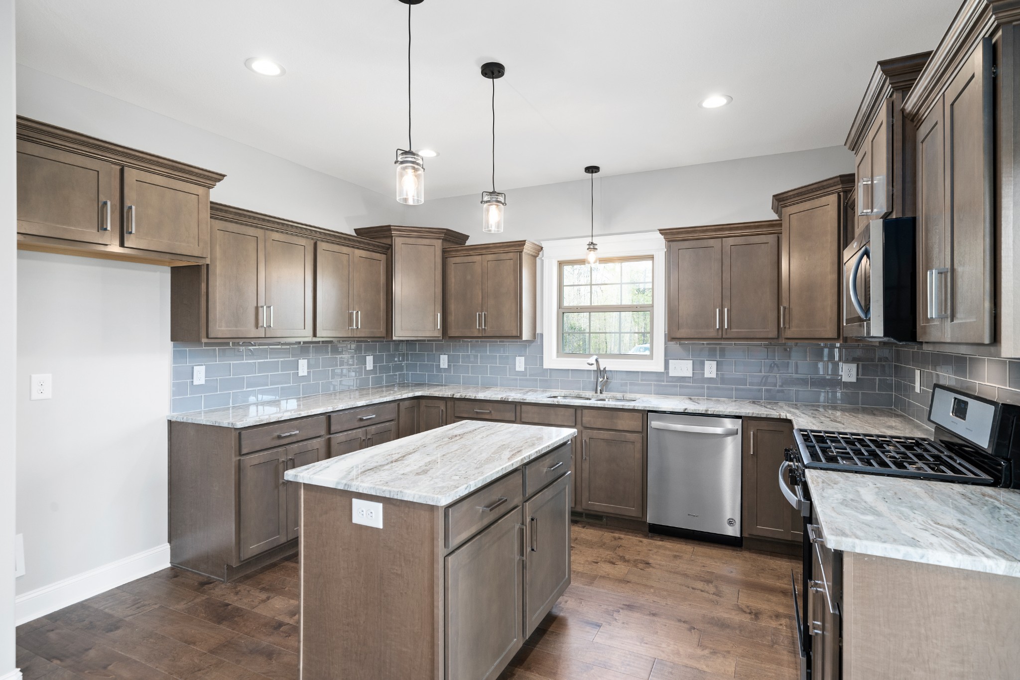267 Alonzo Place Cunningham, TN 37052 - Photo 9 of 40 a kitchen with a sink a stove a refrigerator and cabinets