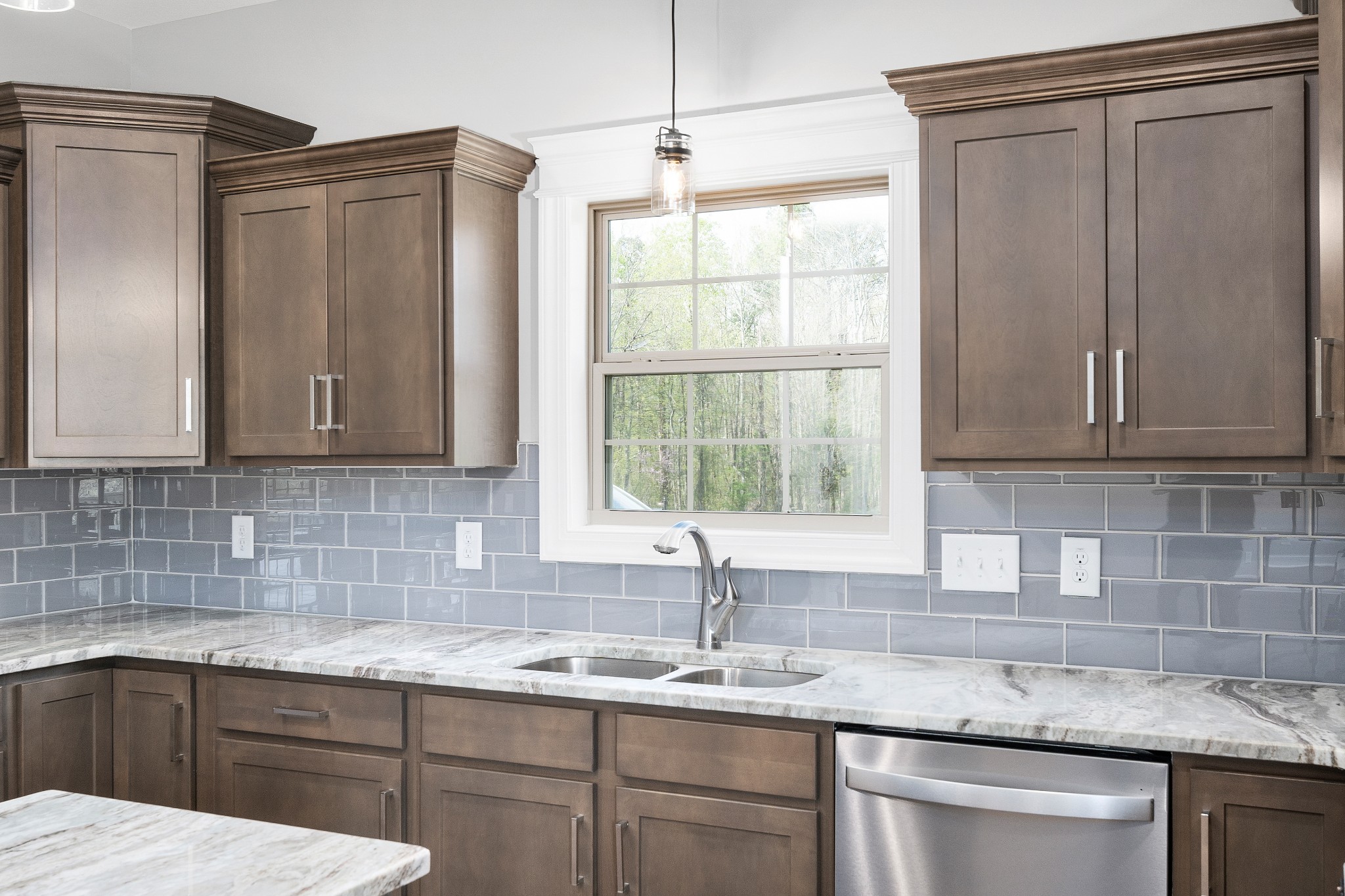 267 Alonzo Place Cunningham, TN 37052 - Photo 10 of 40 a kitchen with granite countertop a sink and a window