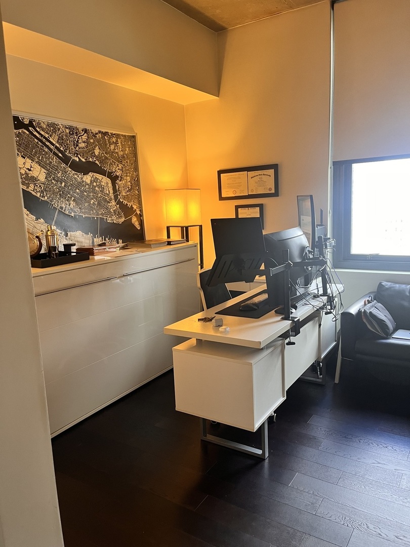 235 West Van Buren Street, Unit 2415 Chicago, IL 60607 - Photo 14 of 19 a living room with a couch