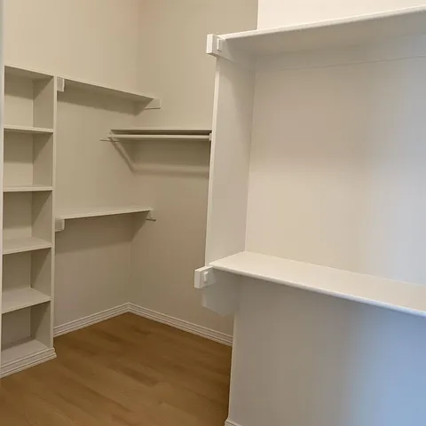 a view of an empty walk in closet