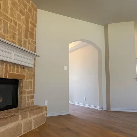 a view of livingroom with wooden floor and fireplace