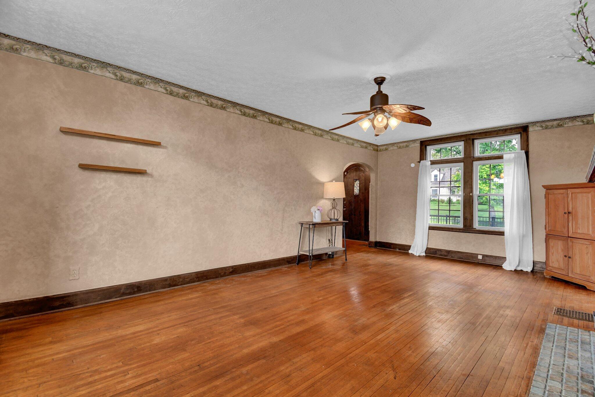 4433 Zeller Road Columbus, OH 43214 - Photo 6 of 34 Transom windows and original hardwood floors