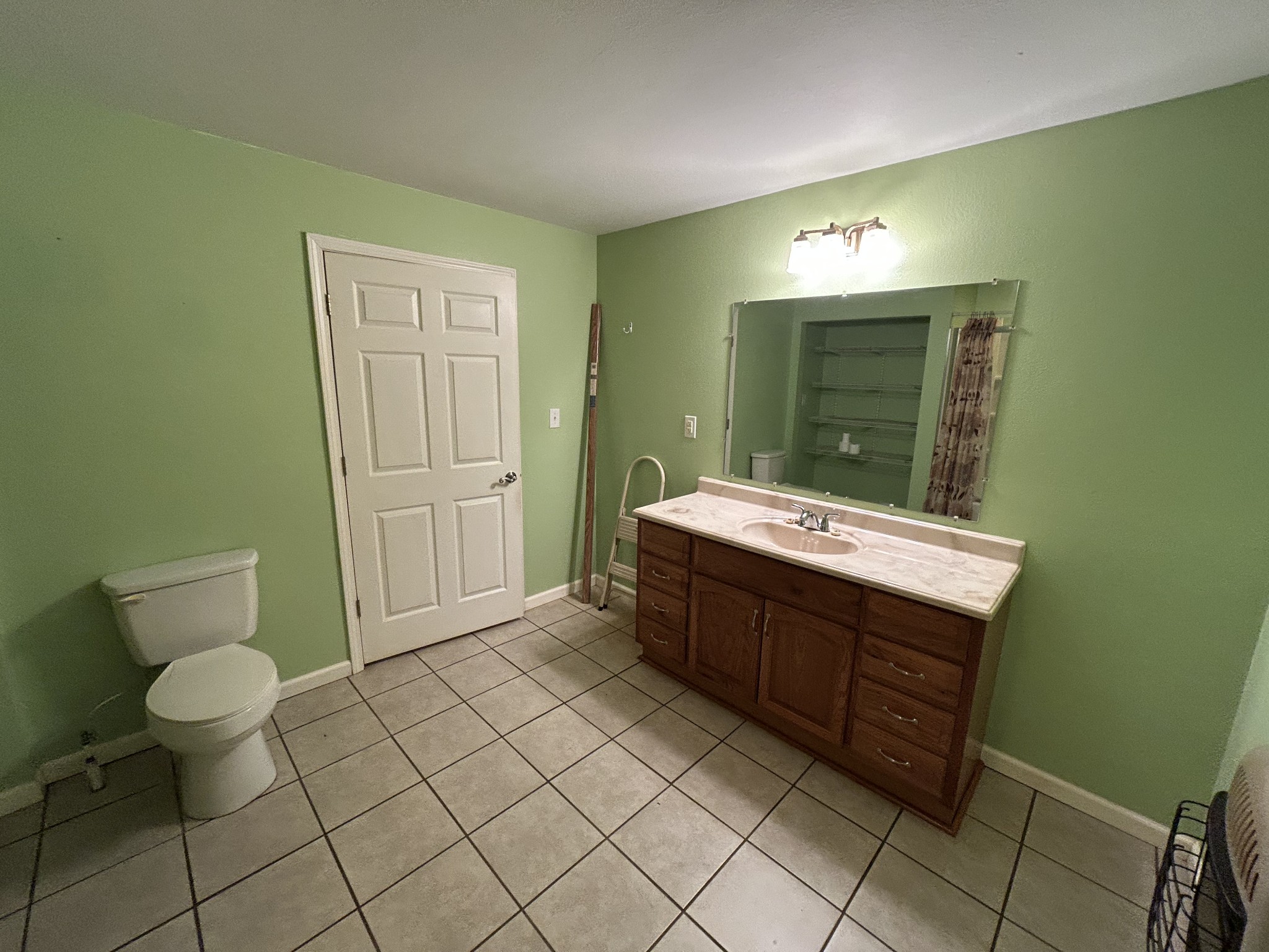 1026 Tom White Road Big Sandy, TN 38221 - Photo 12 of 19 a bathroom with a sink and a mirror
