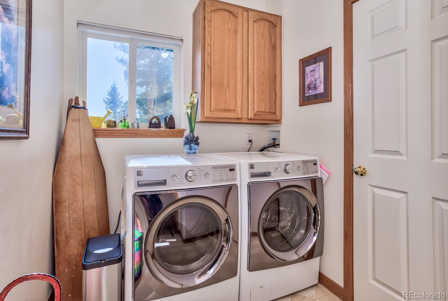 29323 Gray Hawk Drive Evergreen, CO 80439 - Photo 23 of 31 a utility room with dryer and washer