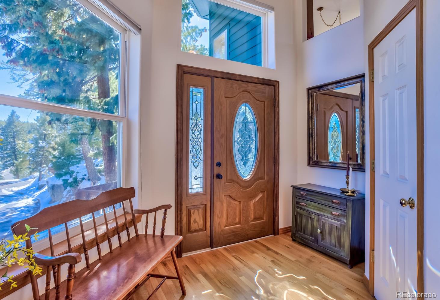 29323 Gray Hawk Drive Evergreen, CO 80439 - Photo 24 of 31 a view of a entryway door front of a house