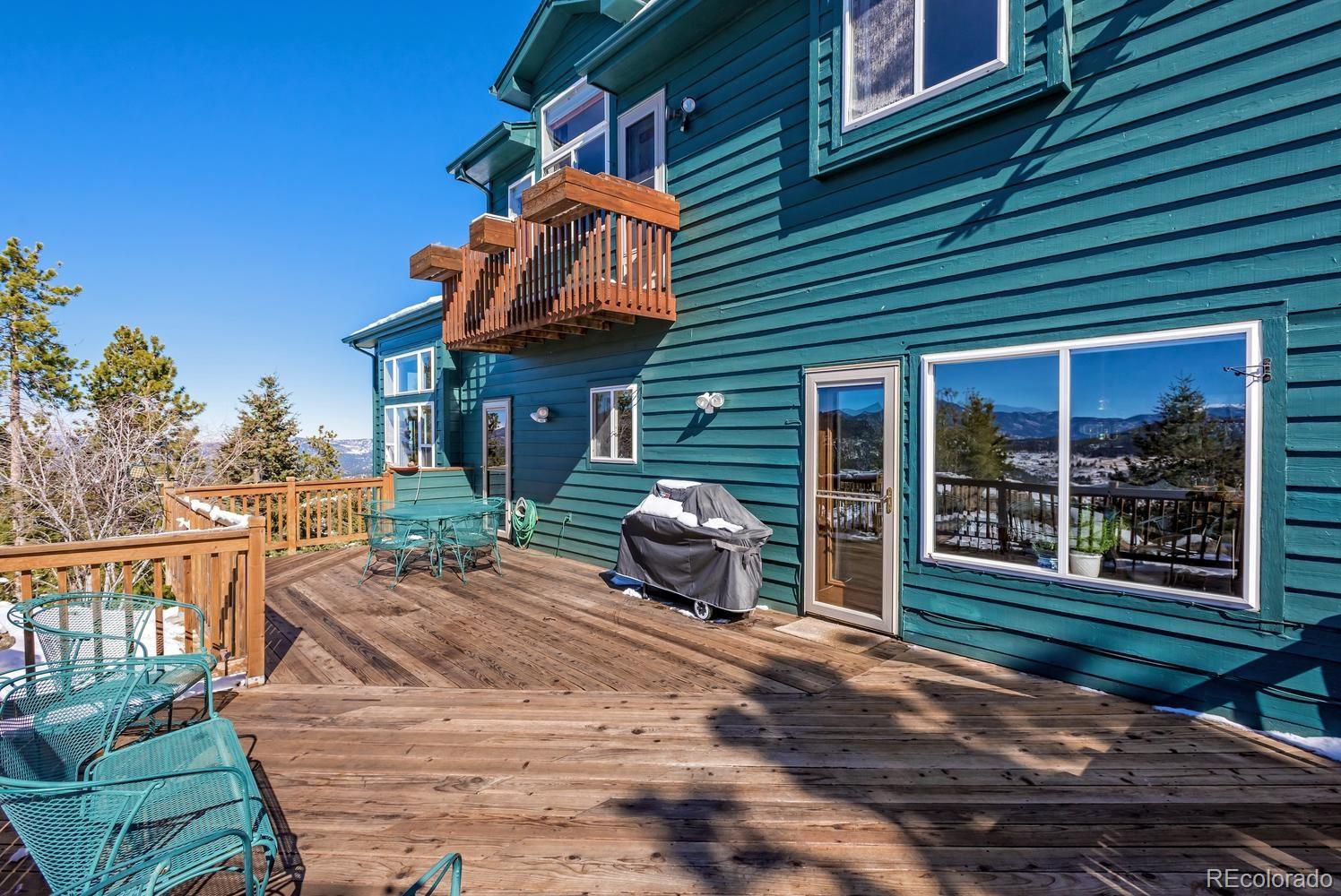 29323 Gray Hawk Drive Evergreen, CO 80439 - Photo 27 of 31 a house view with a seating space