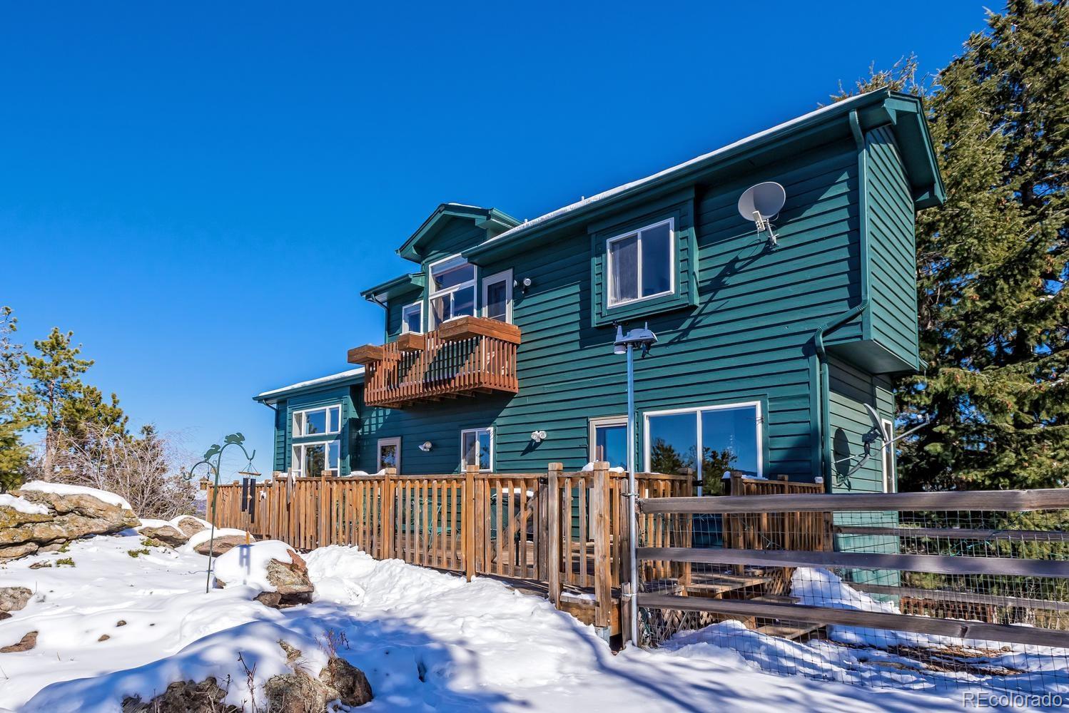 29323 Gray Hawk Drive Evergreen, CO 80439 - Photo 30 of 31 a view of house with outdoor space