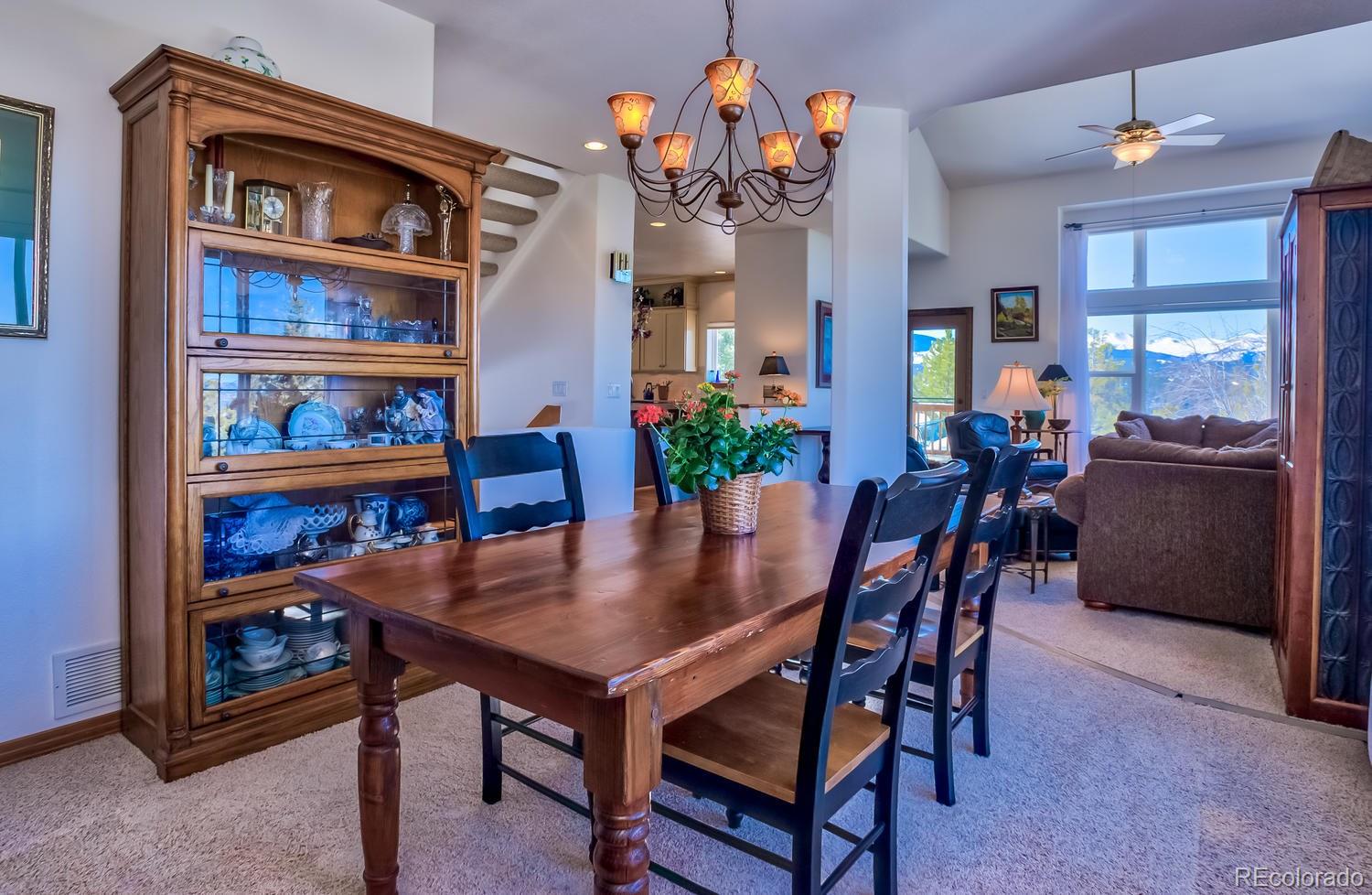 29323 Gray Hawk Drive Evergreen, CO 80439 - Photo 9 of 31 a view of a dining room with furniture