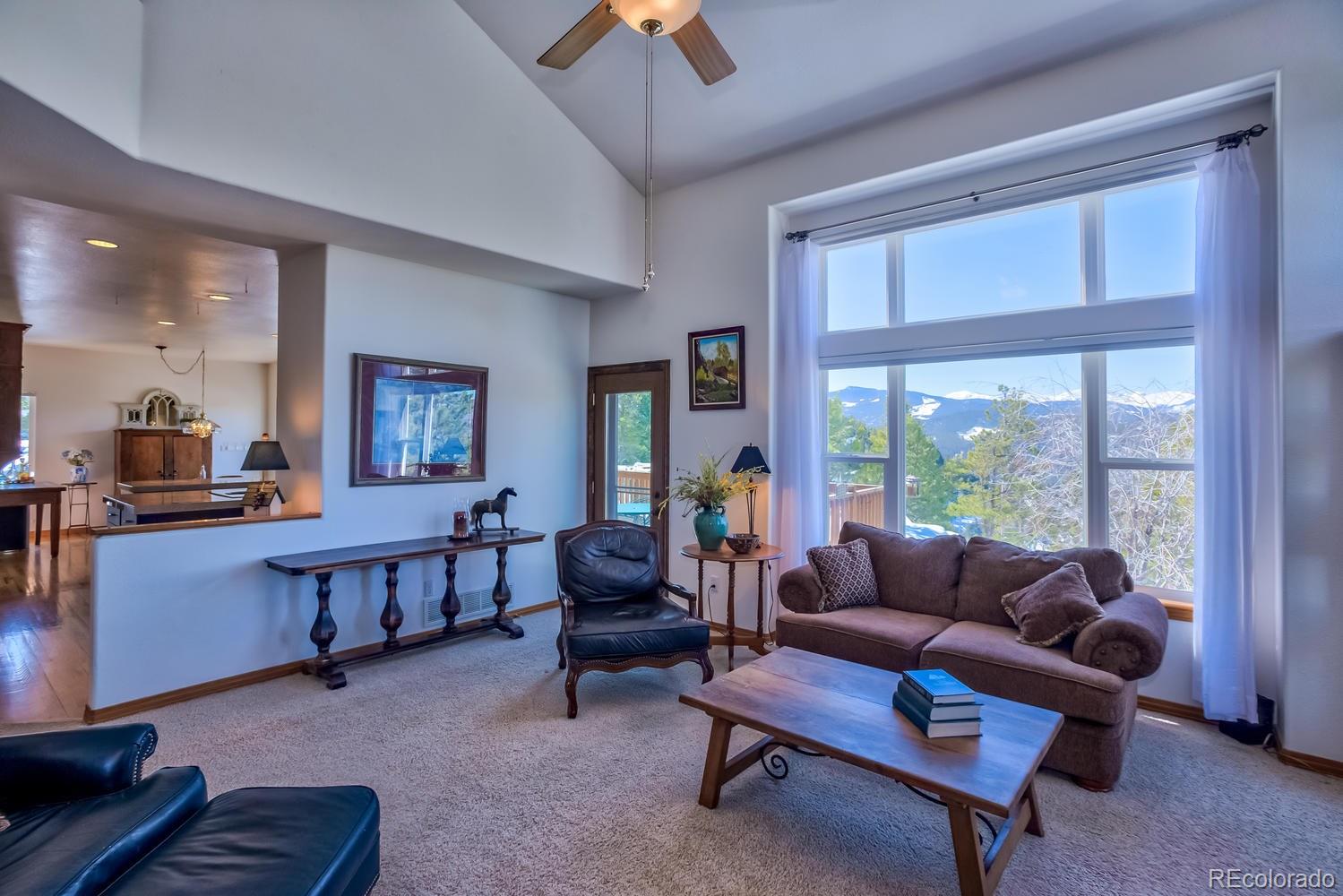 29323 Gray Hawk Drive Evergreen, CO 80439 - Photo 10 of 31 a living room with furniture and a window