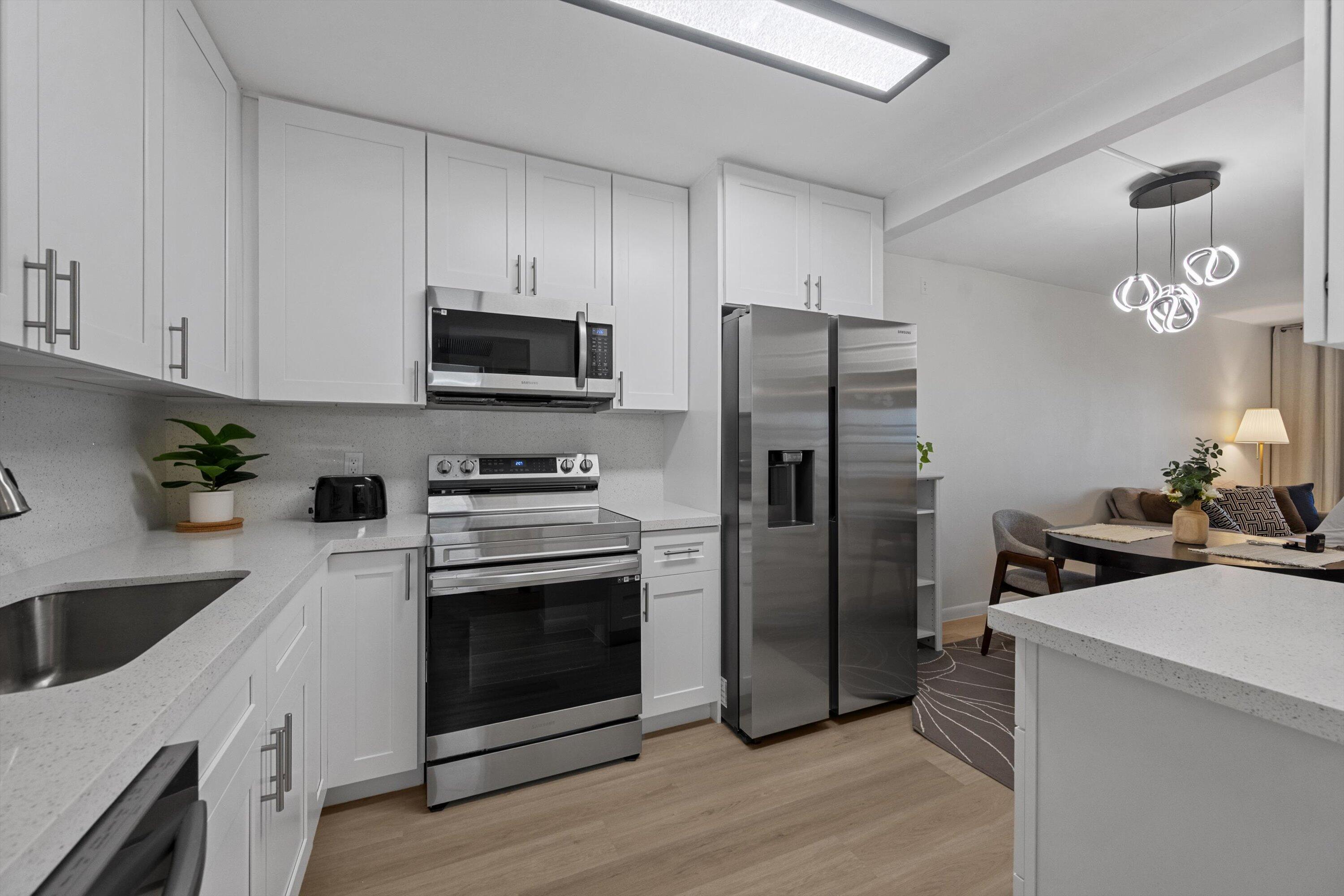 a kitchen with a stove and a refrigerator