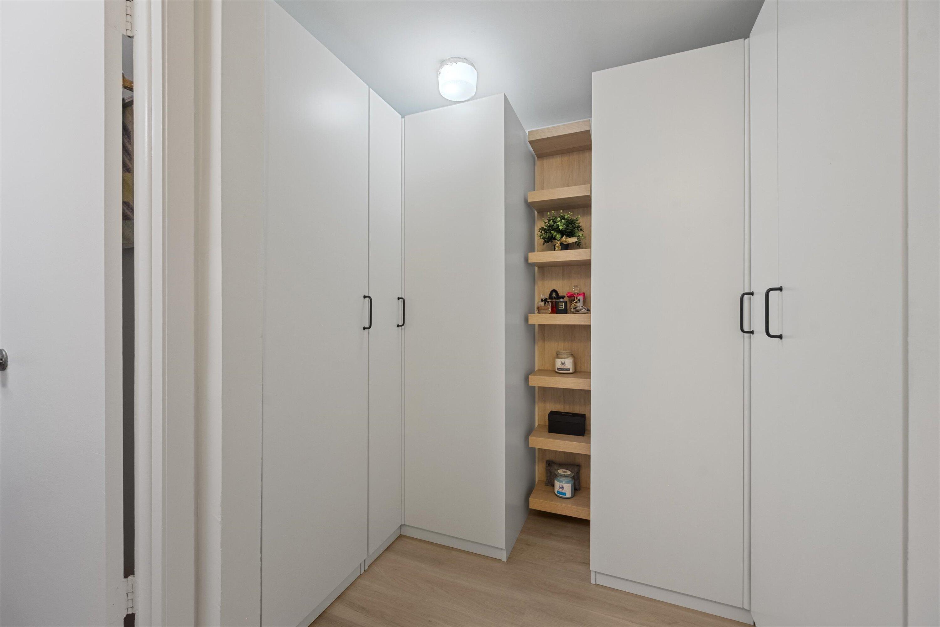 9273 Southwest 8th Street, Unit 416 Boca Raton, FL 33428 - Photo 15 of 19 a view of walk in closet with empty racks