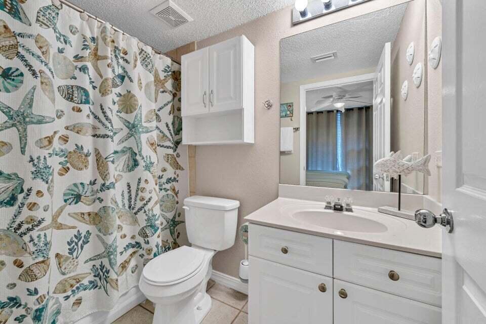 520 Santa Rosa Boulevard, Unit 217 Fort Walton Beach, FL 32548 - Photo 17 of 26 a bathroom with a sink and a toilet