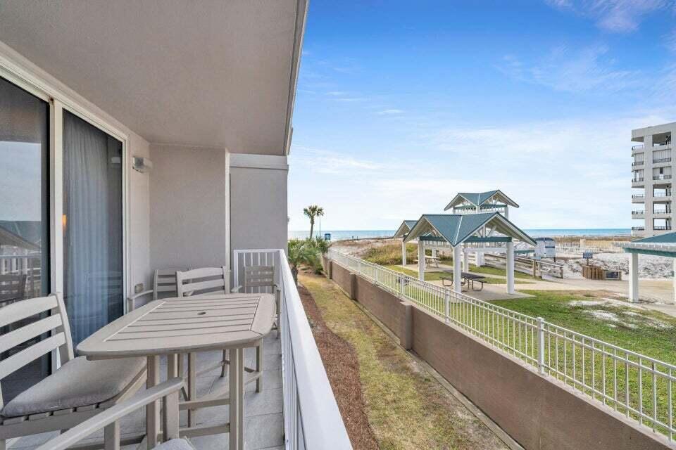 520 Santa Rosa Boulevard, Unit 217 Fort Walton Beach, FL 32548 - Photo 20 of 26 a view of a balcony with two chairs and a table