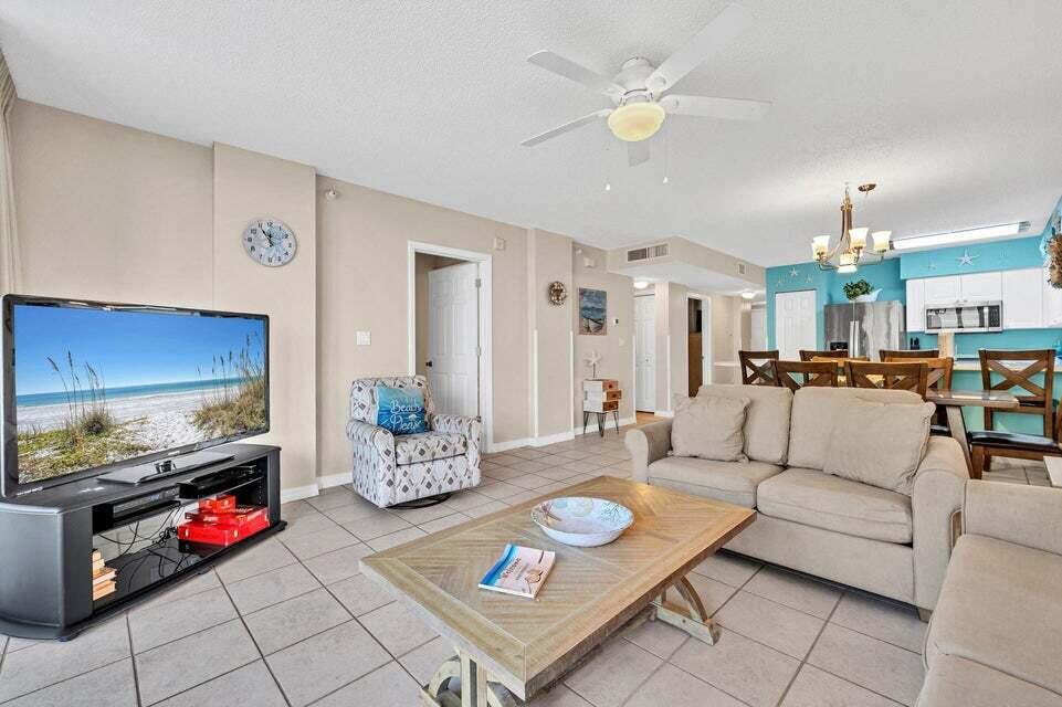 520 Santa Rosa Boulevard, Unit 217 Fort Walton Beach, FL 32548 - Photo 4 of 26 a living room with furniture and kitchen view